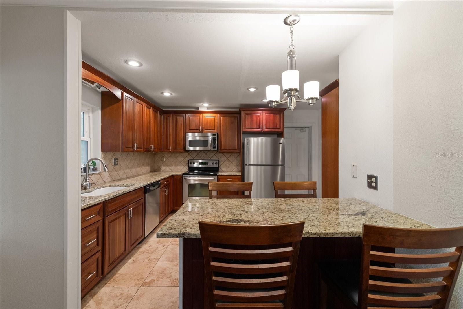 Kitchen with Upgraded Finishes and Island Seating