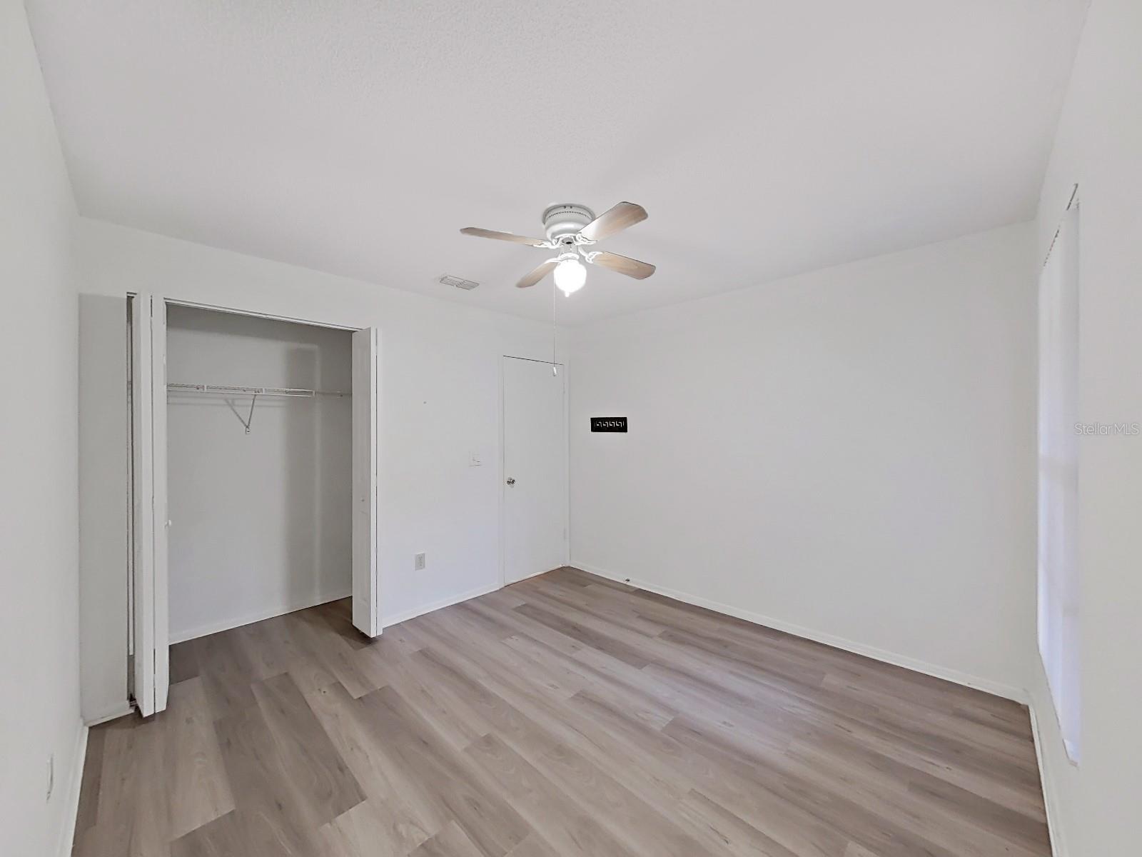 2nd Bedroom with Opened Vloset Door.