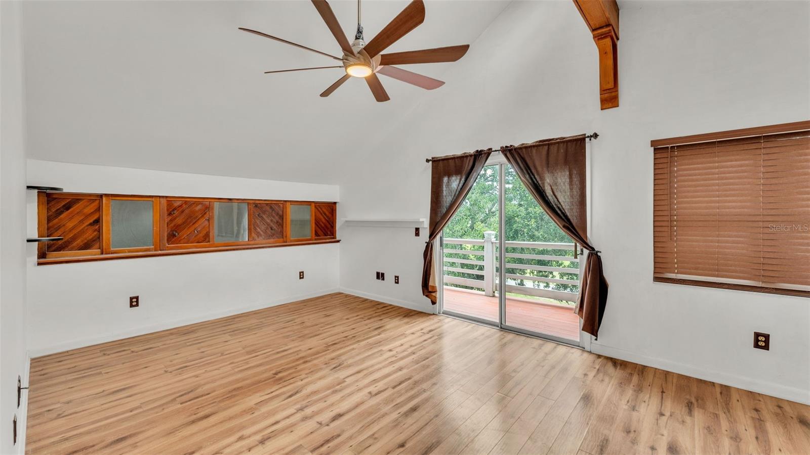 Primary Bedroom ~ Featuring sliding glass doors with a Balcony