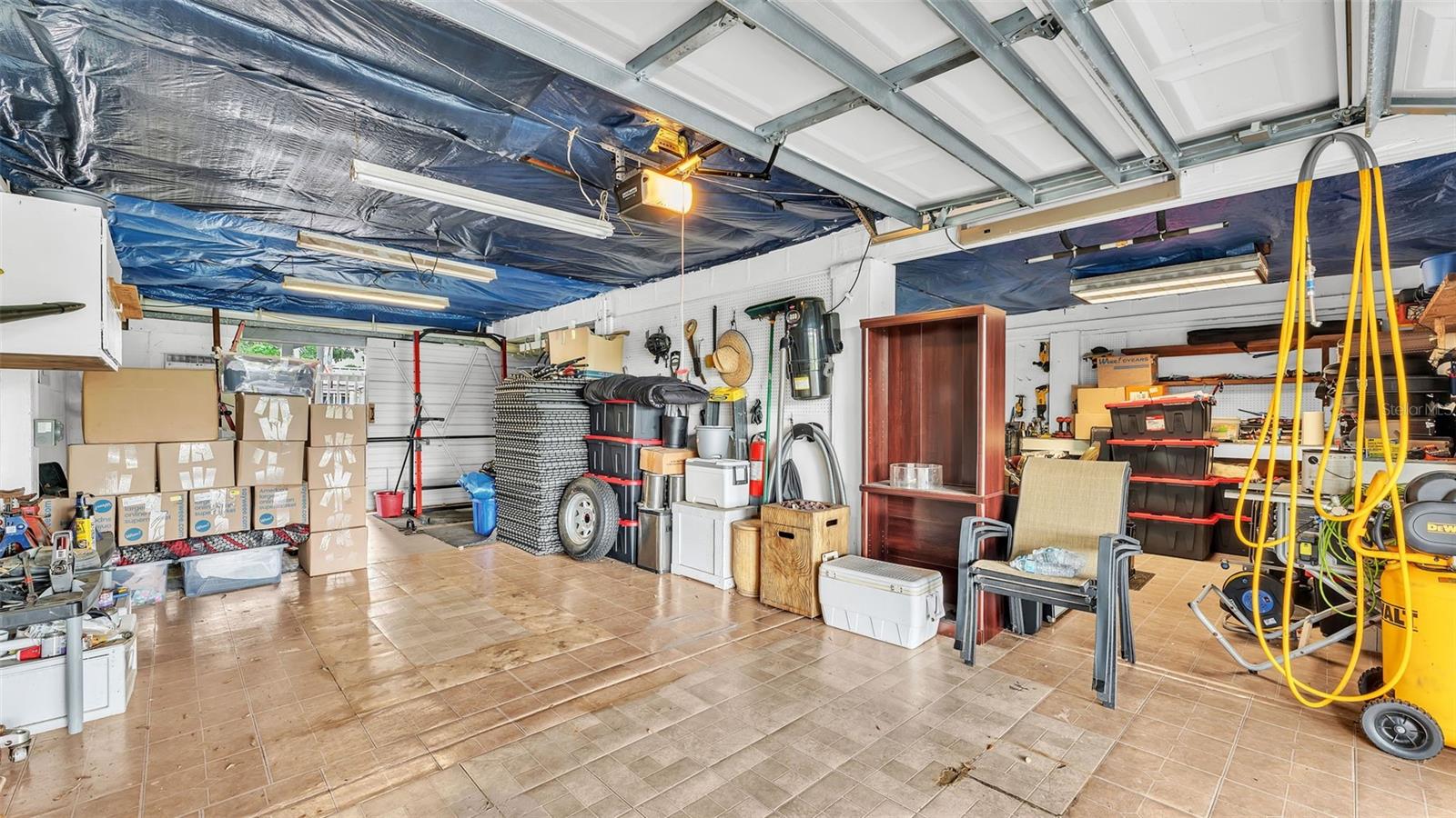 1 car Garage on one side & Workshop + Storage on the other side. Plus full In-Law Suite apartment downstairs