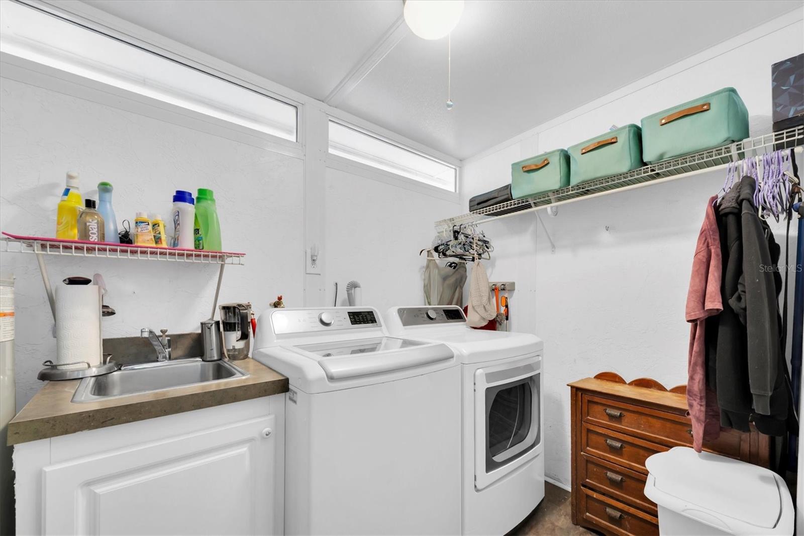 Nice sized laundry room with storage space