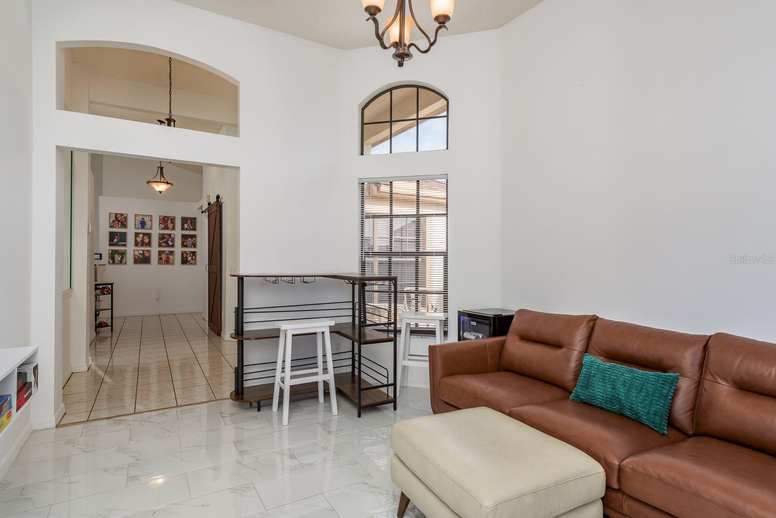 Room located off the entry would make the perfect family room, game room, or formal dining room