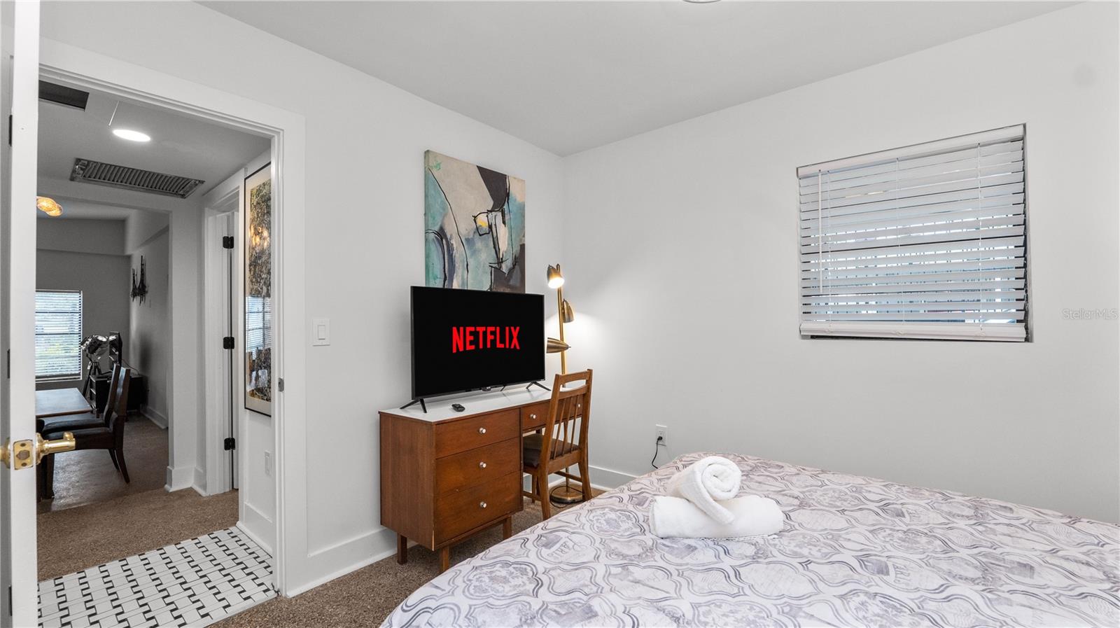 Bedroom #2 with a vintage desk & flatscreen