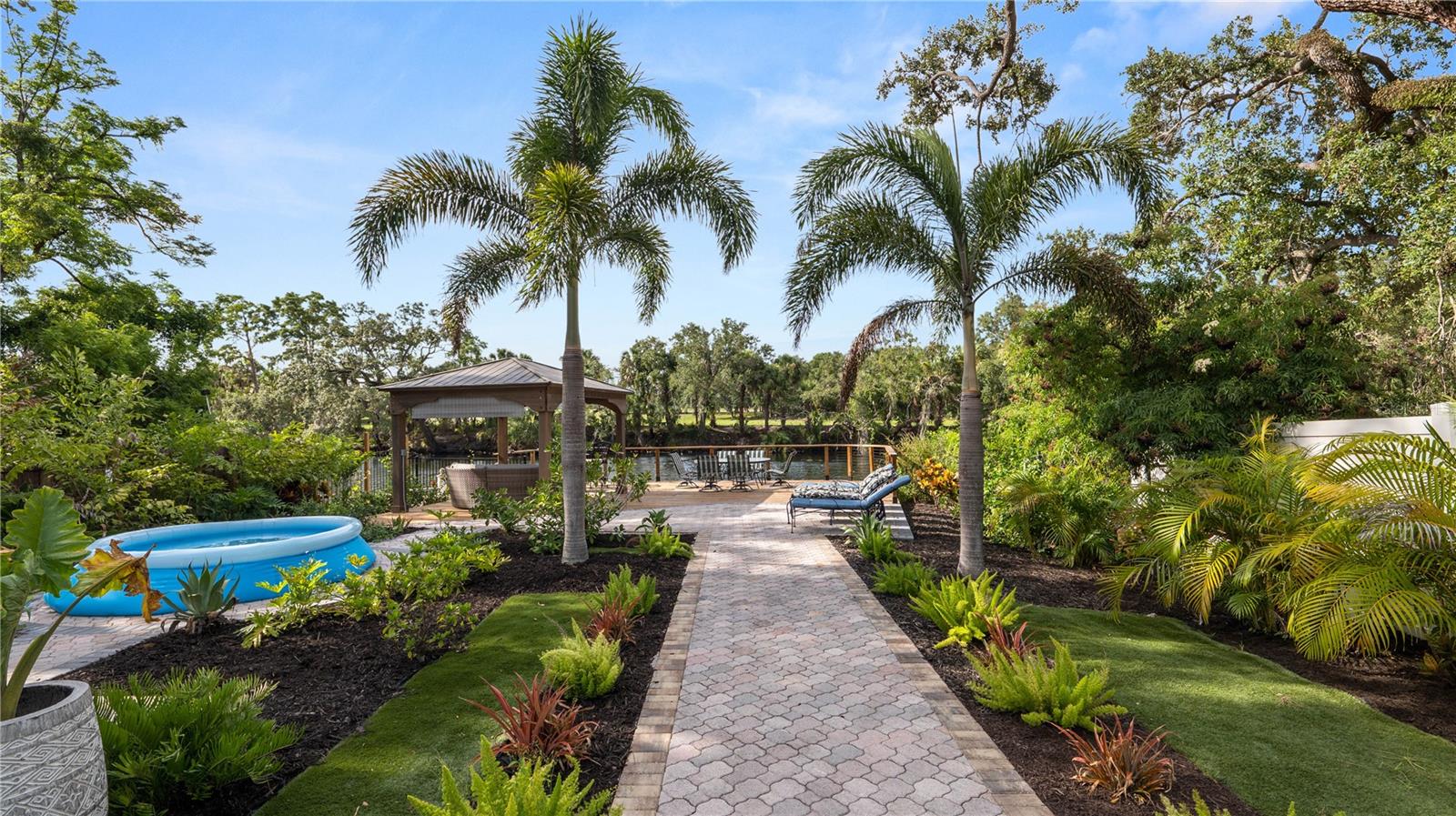 Take a walk down the luxe landscape to sit by the water