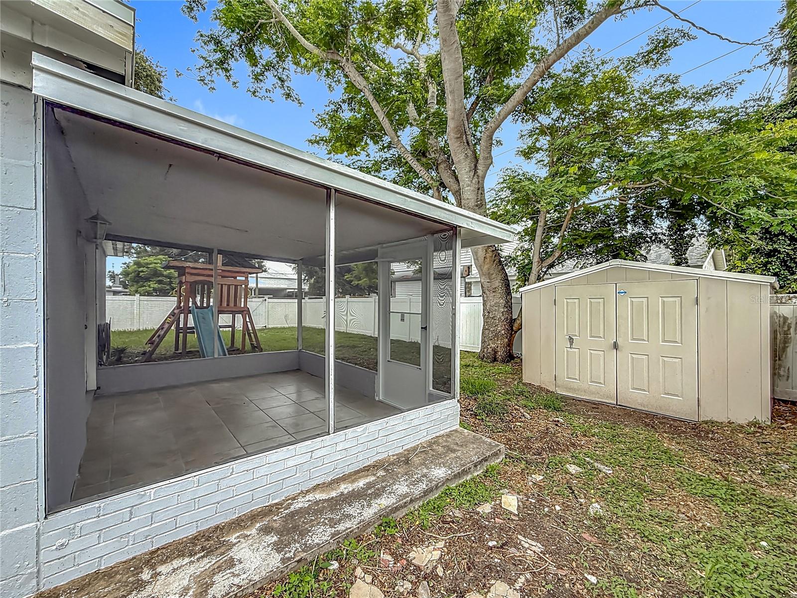 Enclosed back patio and shed for additional storage