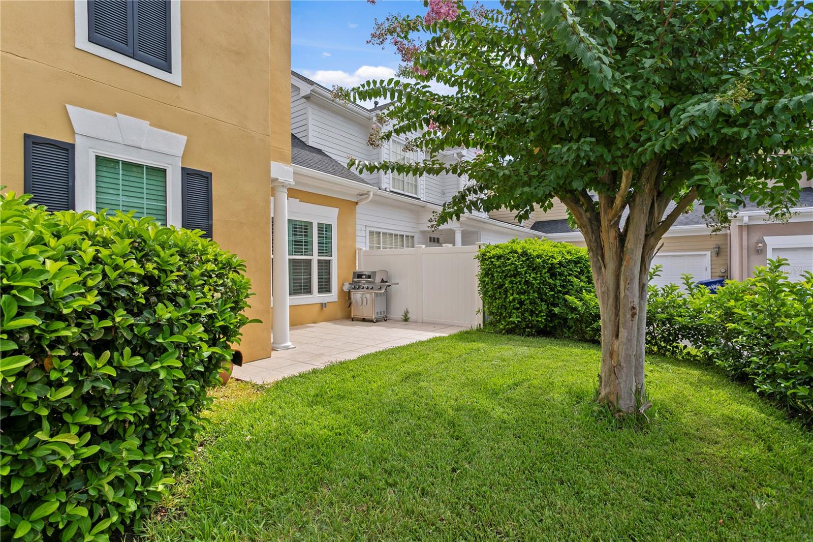 Gorgeous yard (maintained by HOA) -- largest outdoor space in this community.