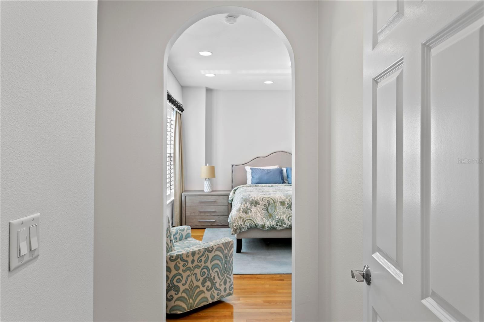 The spacious primary suite welcomes you with an elegant door entry.