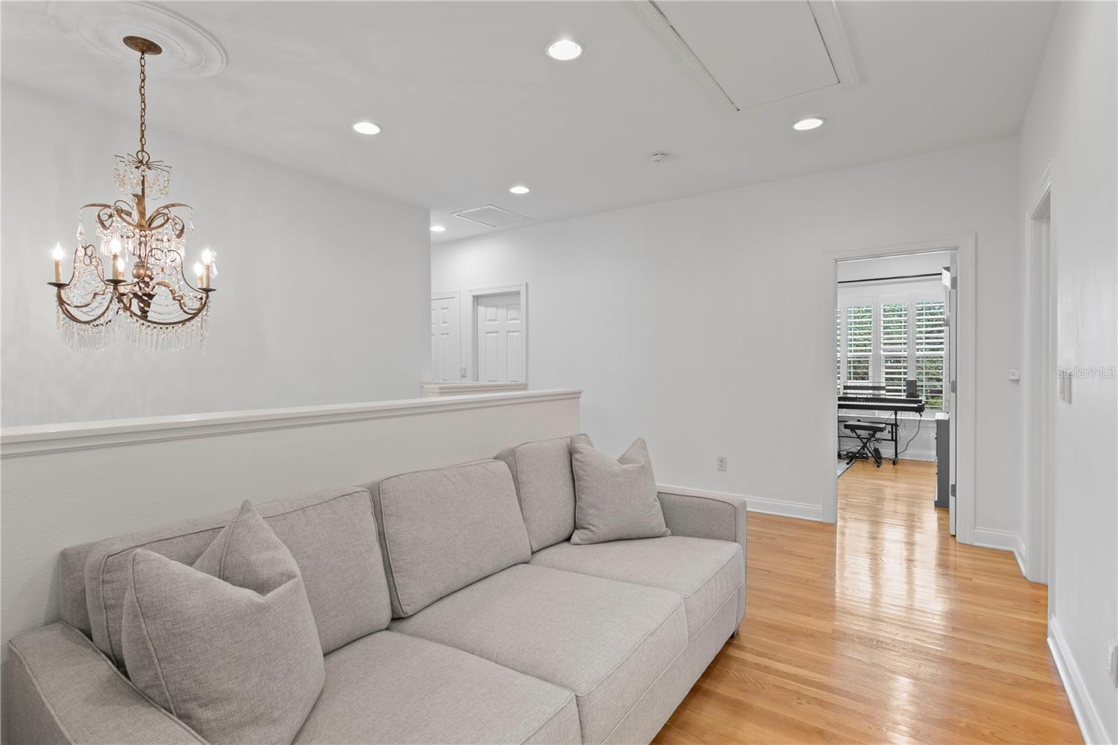 Exiting the primary suite, you’ll find the laundry room and three more spacious bedrooms down the upstairs hallway