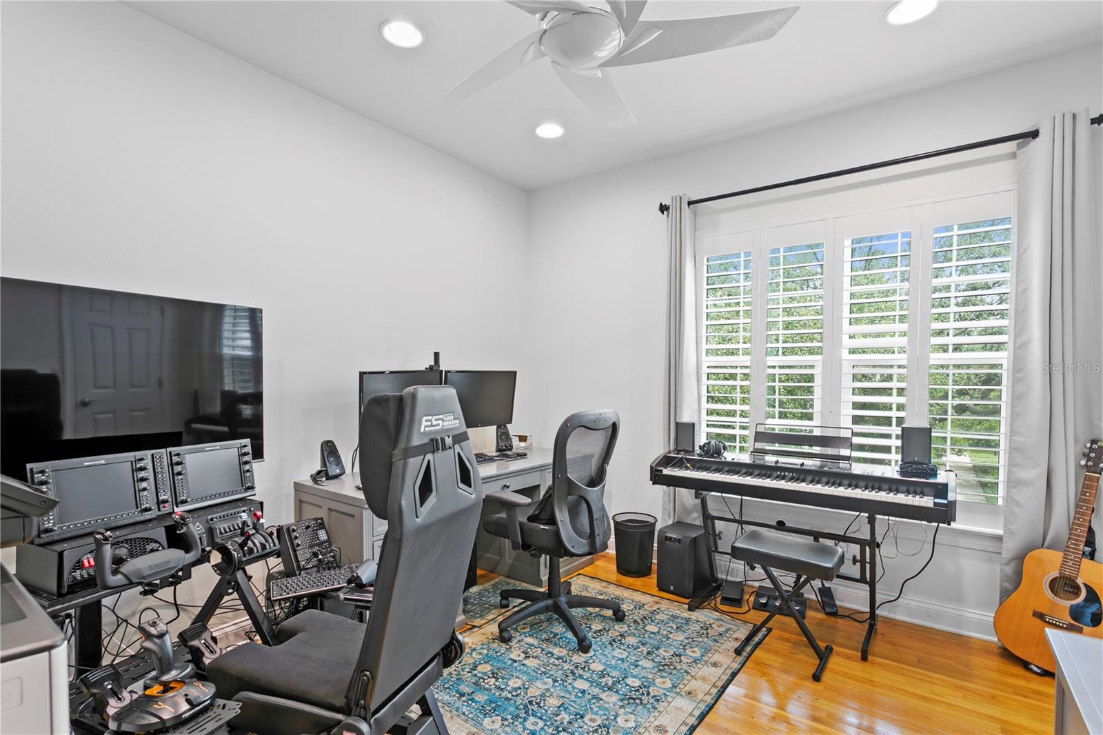 Currently used as an office, this generously sized bedroom offers versatile space to suit your needs.
