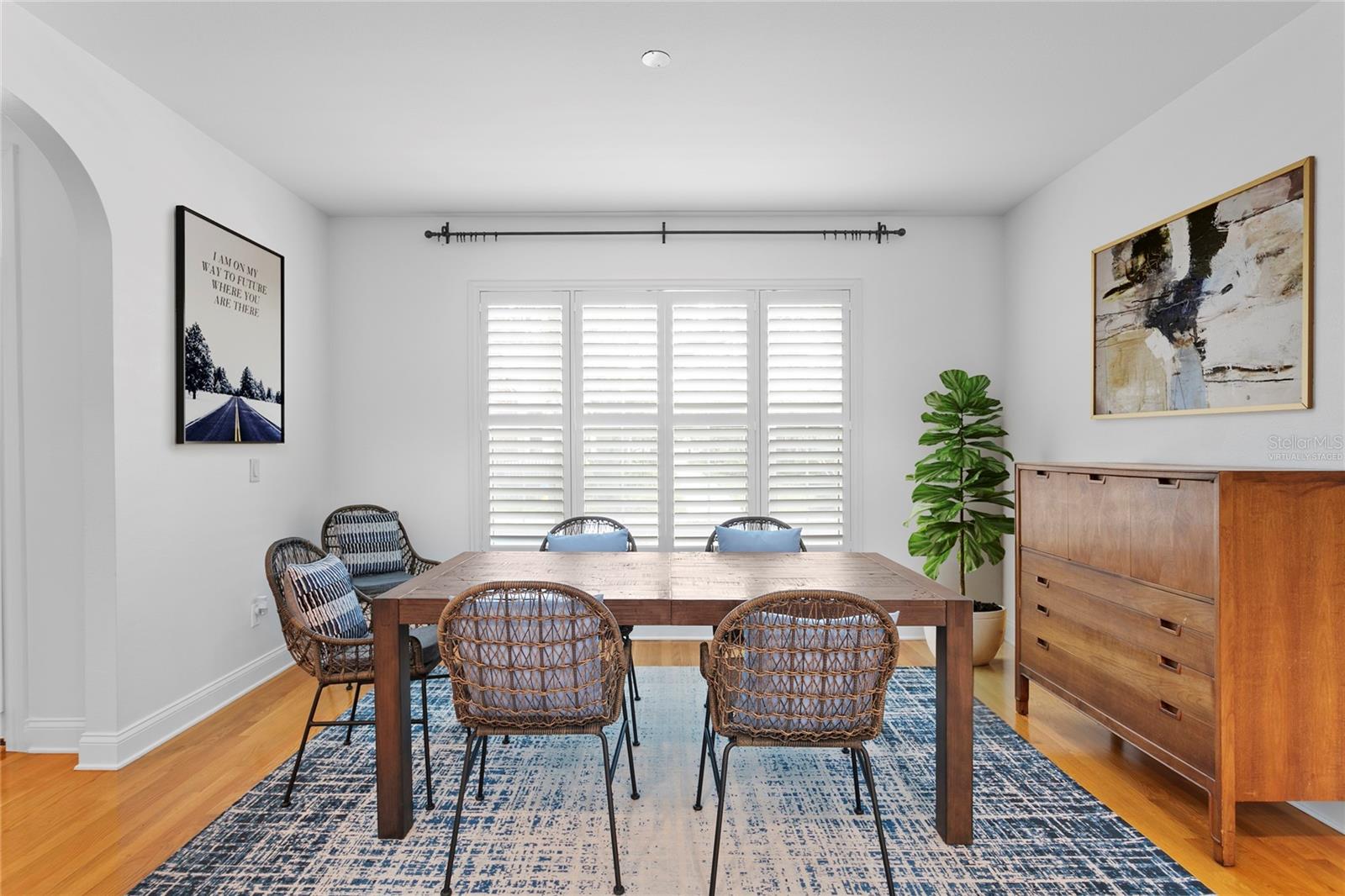 Virtually staged photo of the accessories within the inviting dining room