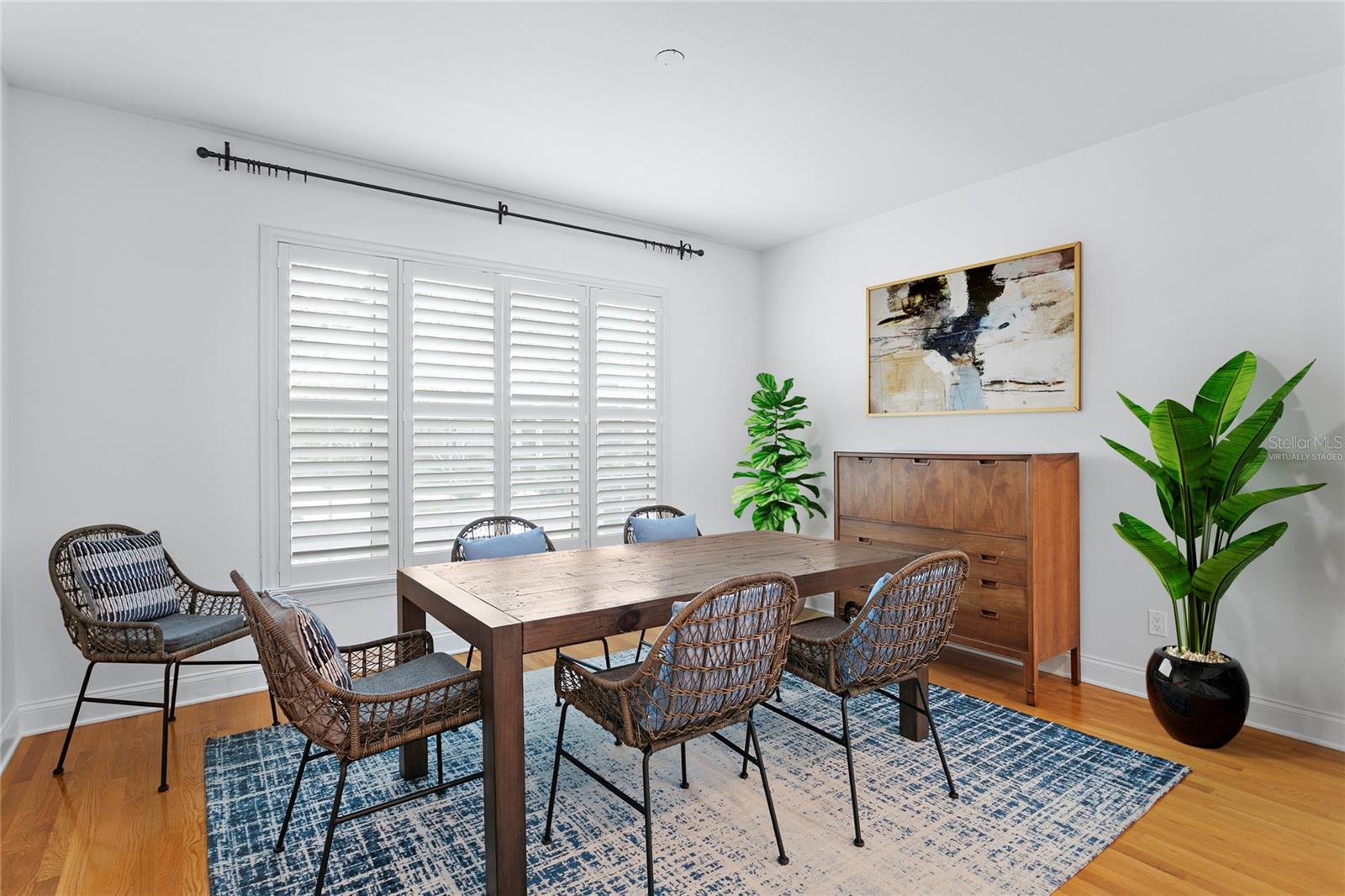 Virtually staged photo of the accessories within the inviting dining room