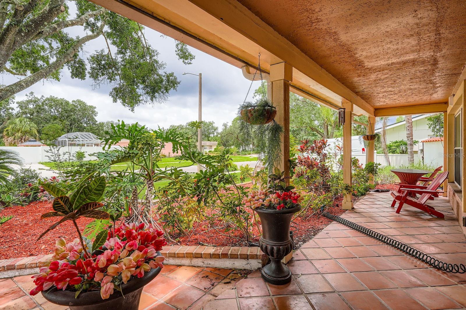 Front porch with lush landscaping