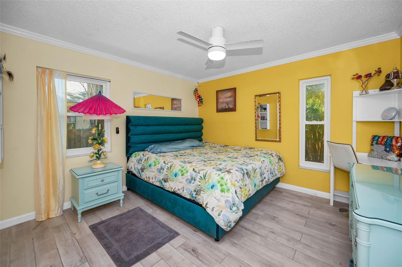 Cheerful Primary bedroom with lots of natural light