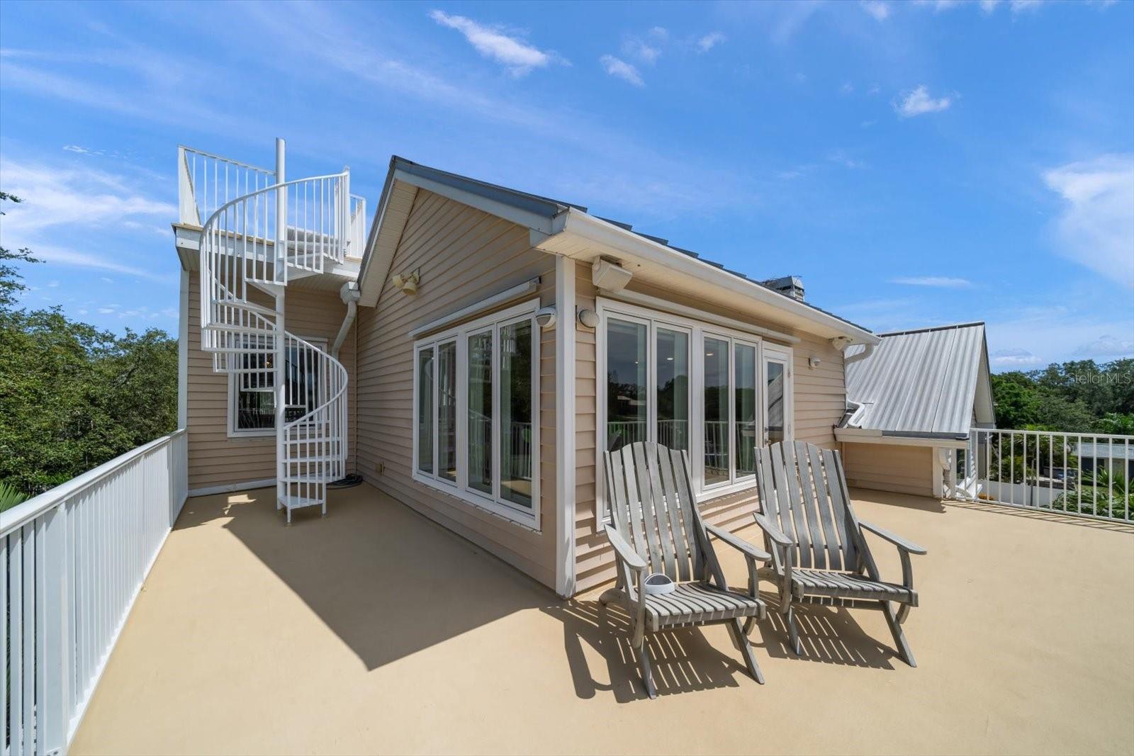 Expansive Master Balcony with Stairs to Observation Deck