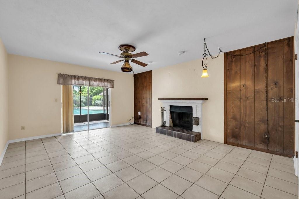 Family room with wood burning fireplace