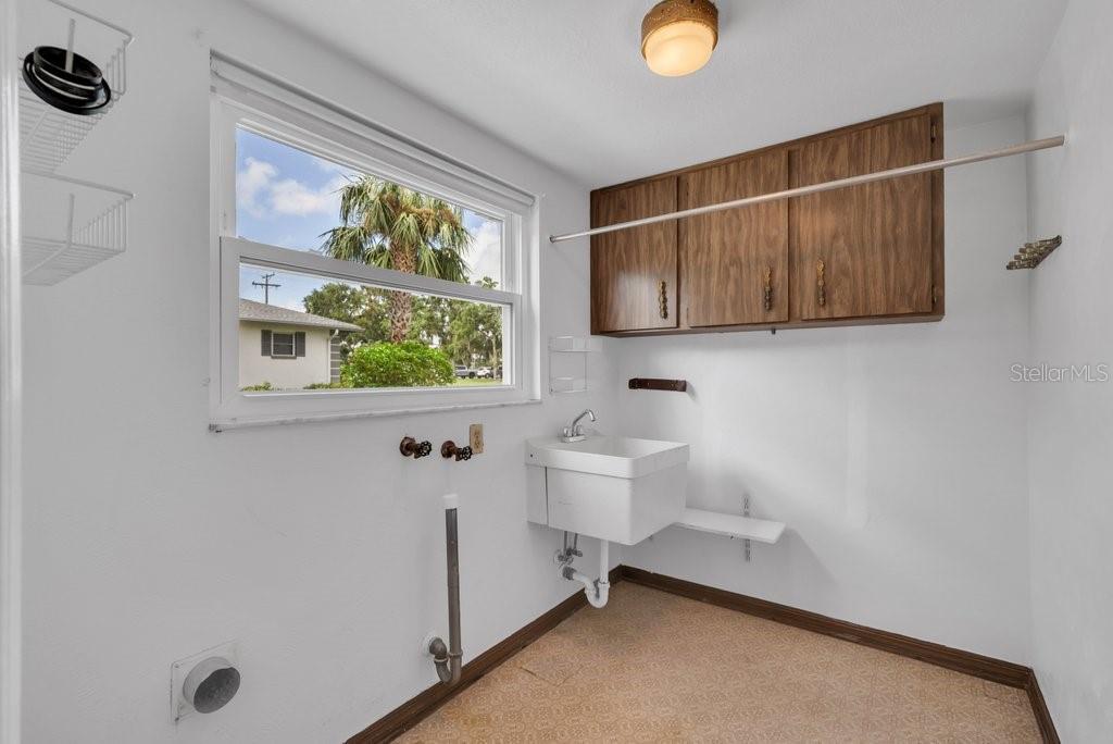 Inside utility with sink and storage