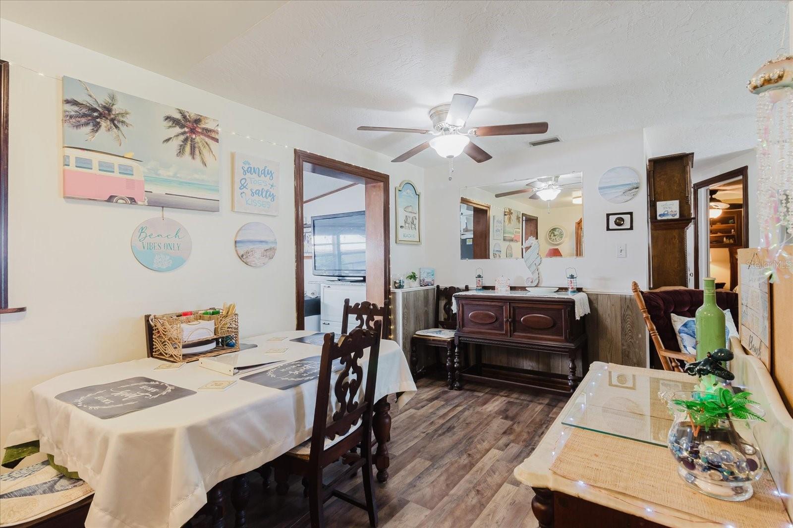 Dining Room With Luxury Vinyl Floors With Doorway To The Updated Kitchen