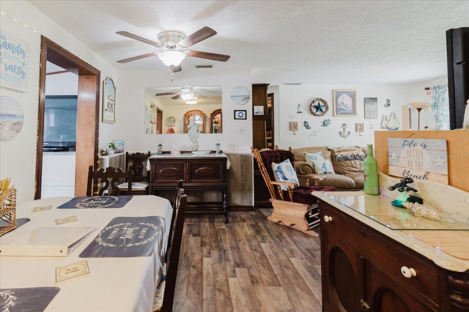 Dining Room With Luxury Vinyl Floors With Doorway To The Updated Kitchen