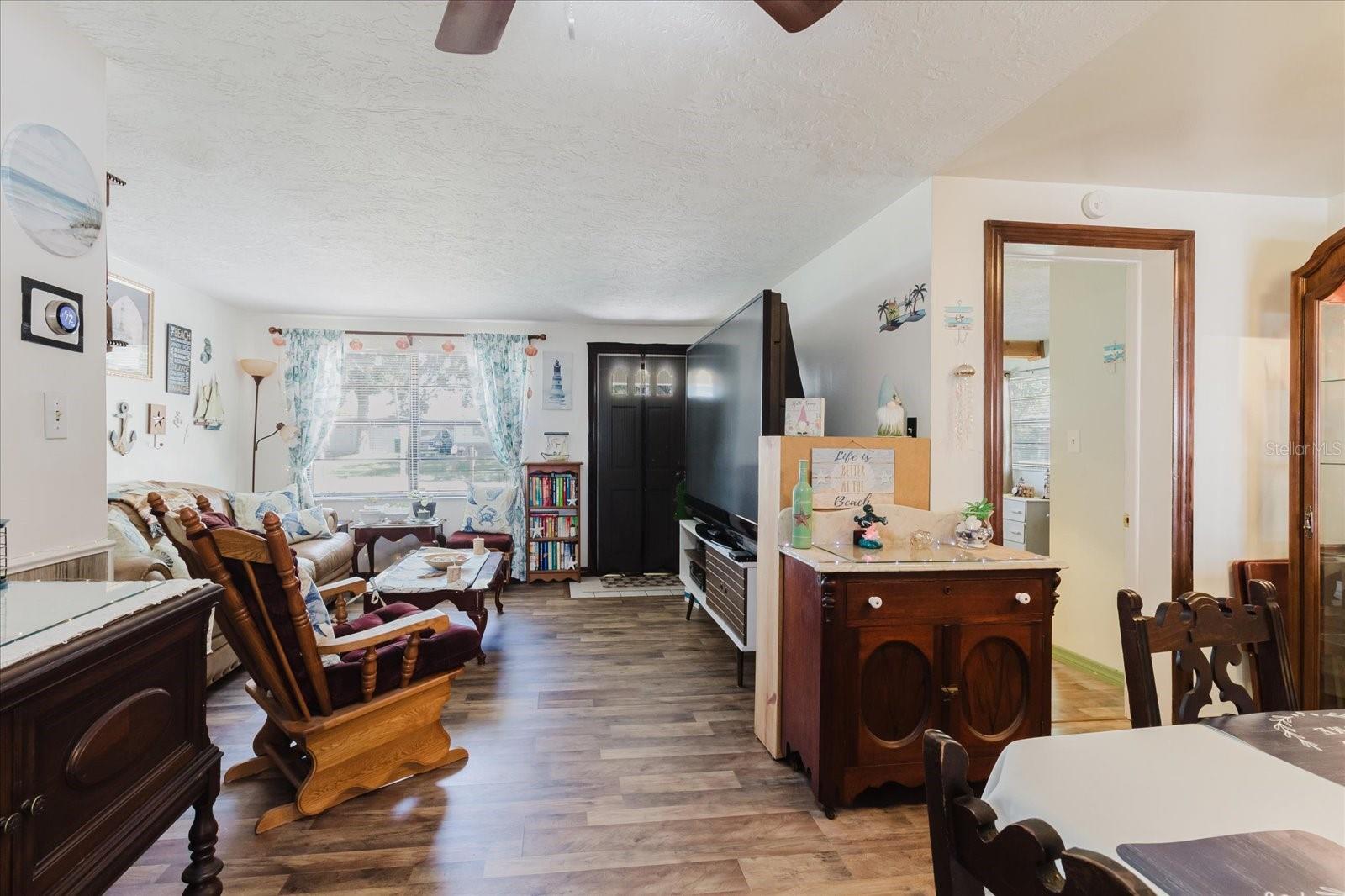 Dining Room With Luxury Vinyl Floors With Doorway To The Secondary Bedroom