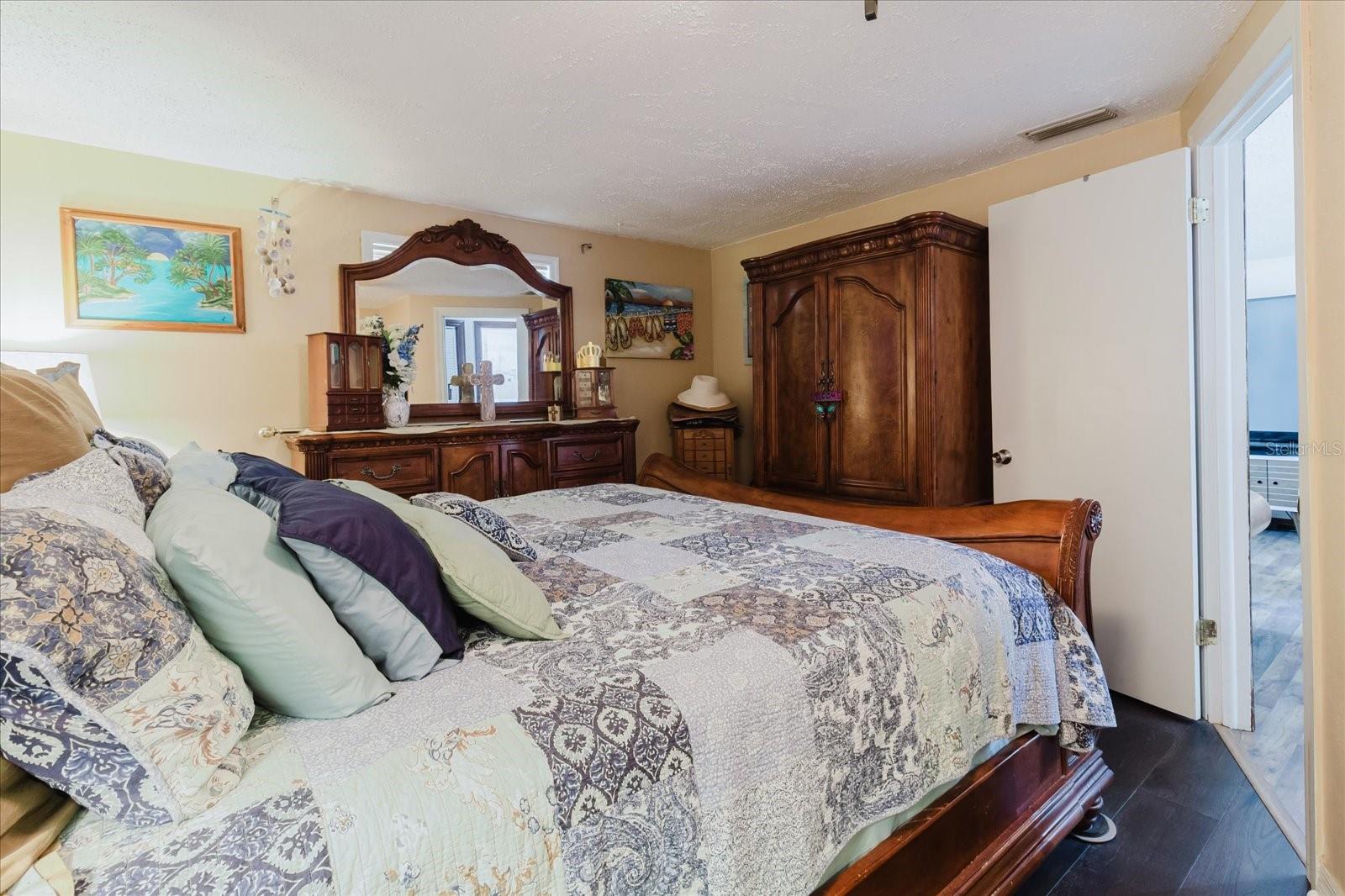 Primary Bedroom With Hardwood Floors