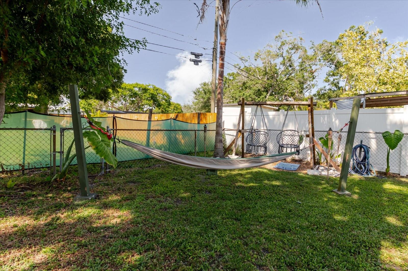Hammock In The Shade and Adult SwingSet For Relaxation and Enjoying Your Visitors Guests