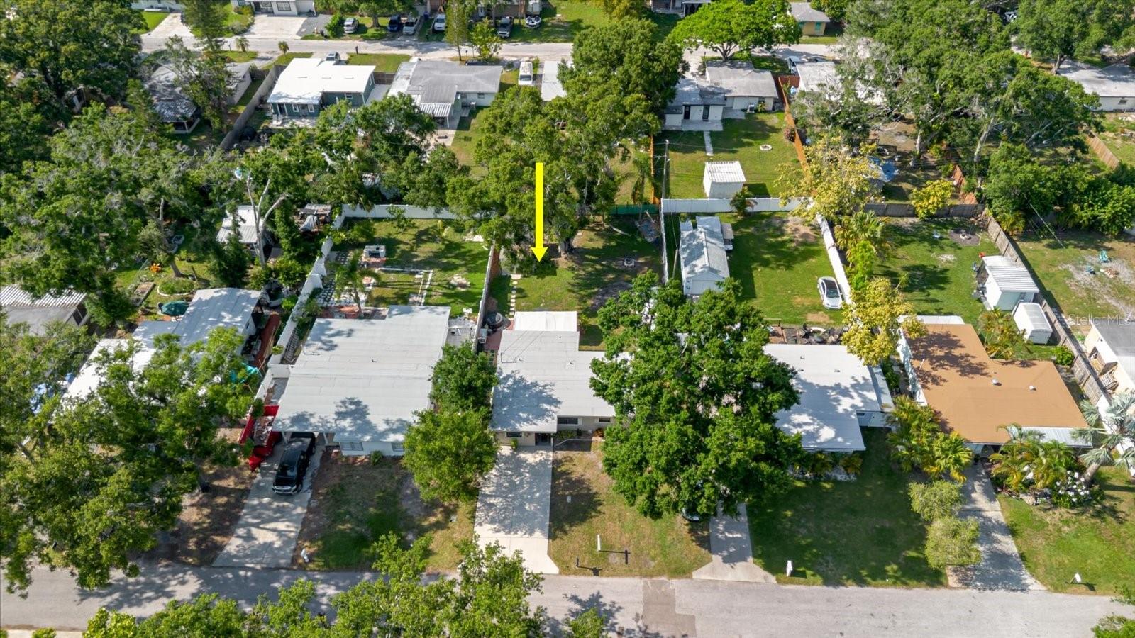 Aerial View. Yellow Arrow Points To The House