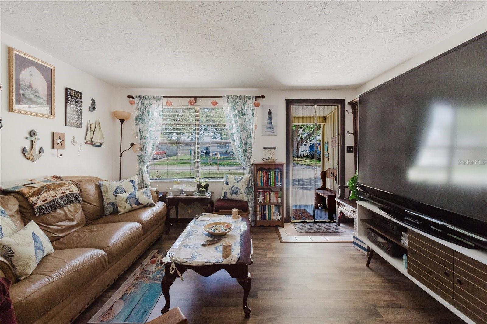 Living Room With View of Front Door. New Luxury Vinyl Floors In May 2025