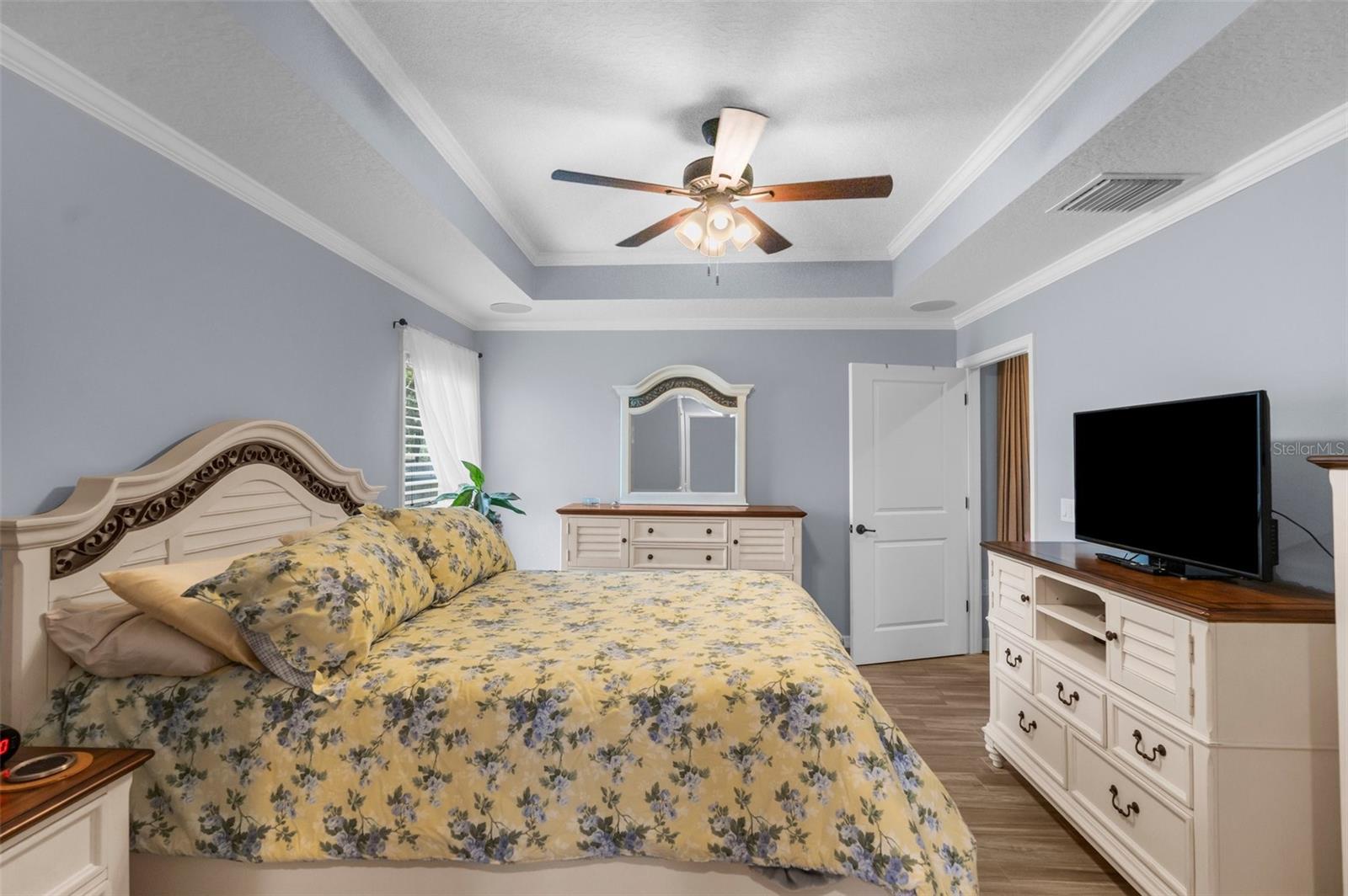 One of two Primary Bedrooms note custom wood work