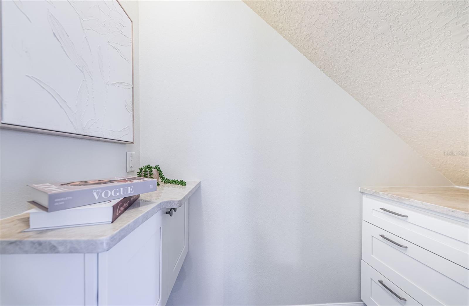 Under stairs  built ins- extra storage or office area
