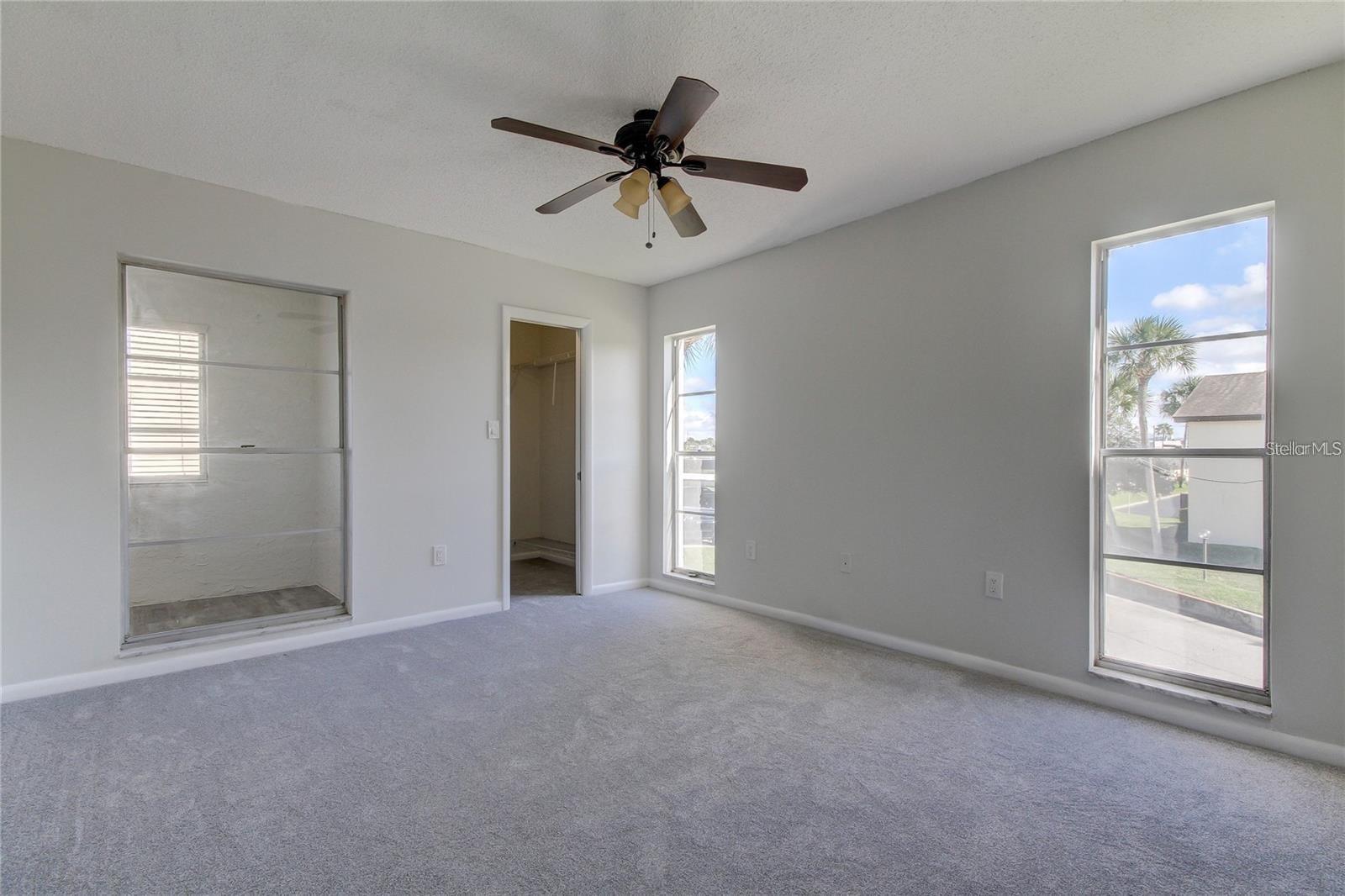 primary bedroom with large walk-in closet