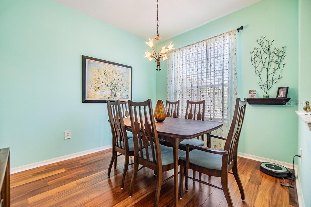 The formal dining room is situated just off the front entry way with doorway to kitchen, pony wall and window for a bright open dining atmosphere.