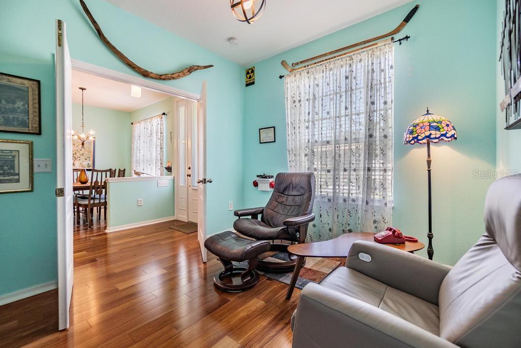 . The fourth bedroom is positioned at the front of the home with double doors, making it ideal for a home office, guest space, or den.