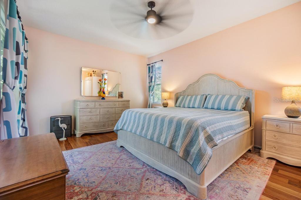 The primary suite is generously sized with access to the patio, a wall closet, and a walk-in closet. The enviable ensuite bath features a double sink vanity with ample storage and counter space, a soaking tub, walk-in shower, linen closet, and private water closet.