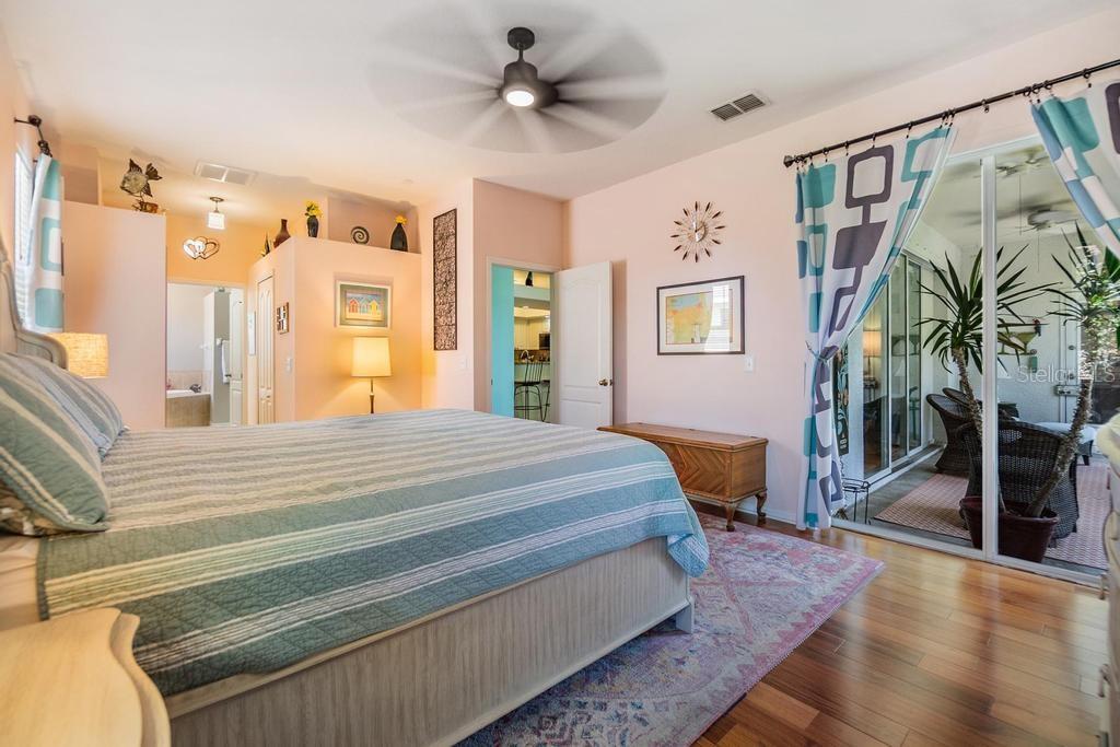 The primary suite is generously sized with access to the patio, a wall closet, and a walk-in closet. The enviable ensuite bath features a double sink vanity with ample storage and counter space, a soaking tub, walk-in shower, linen closet, and private water closet.
