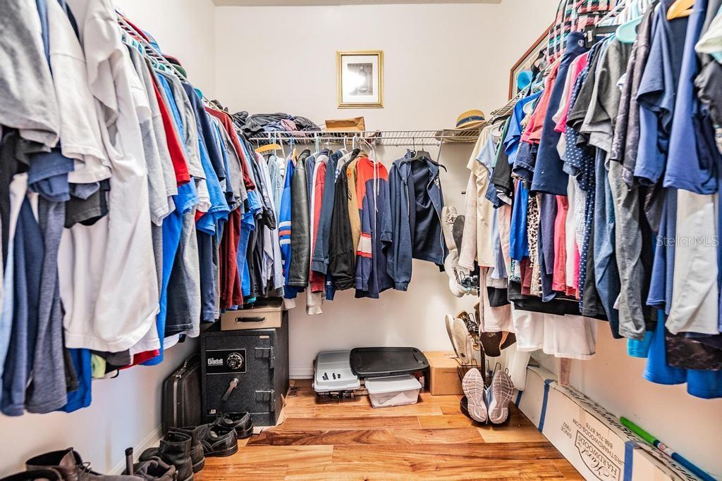 The primary suite is generously sized with access to the patio, a wall closet, and a walk-in closet. The enviable ensuite bath features a double sink vanity with ample storage and counter space, a soaking tub, walk-in shower, linen closet, and private water closet.