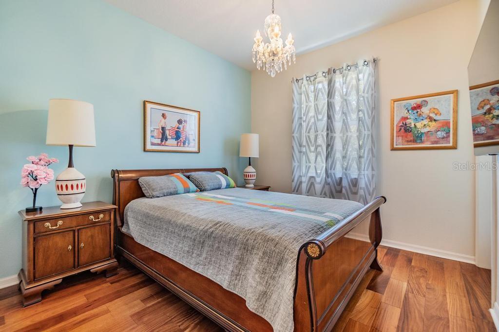 The second bedroom offers a wall closet, beautiful engineered hard wood floors, and a private access door to the patio.
