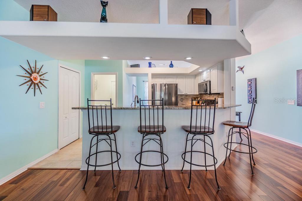 Raised breakfast bar that opens to the living room—ideal for casual dining or keeping conversations going while you prepare meals.