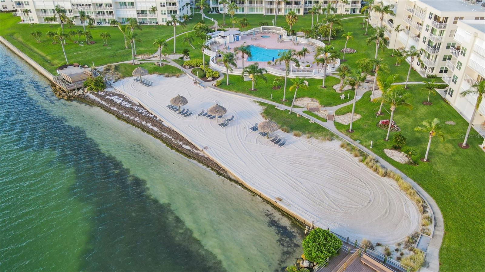 Private Beach With Tiki Huts & chairs