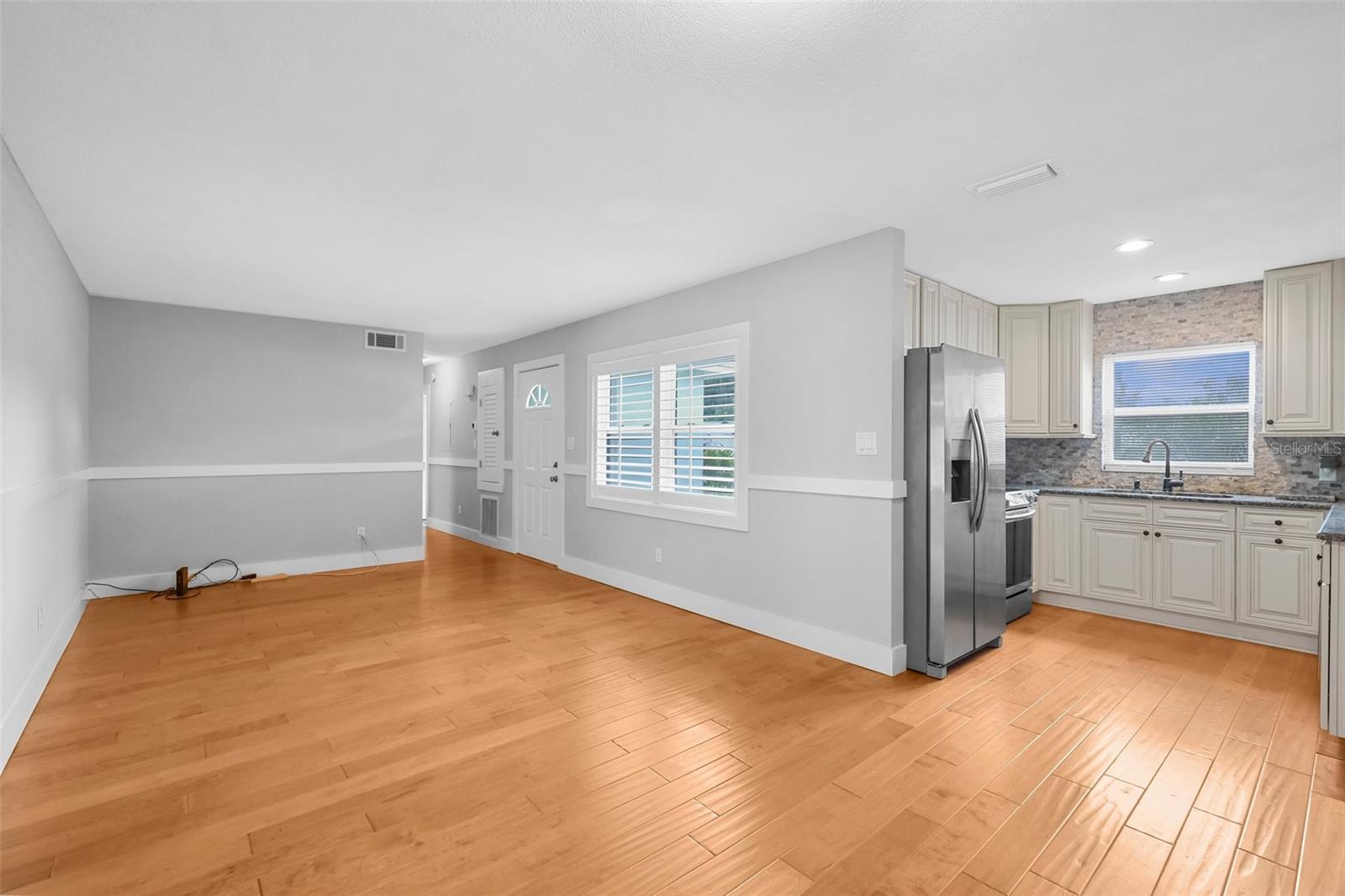 Large main living room open to the kitchen with breakfast table area, too.