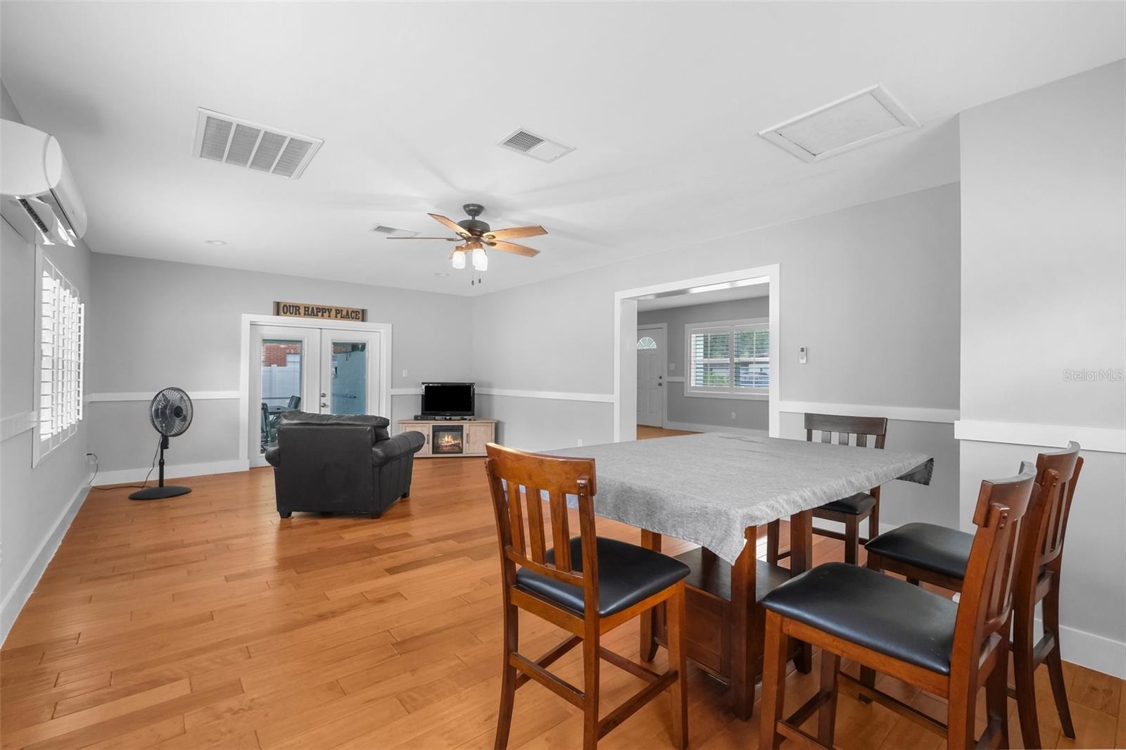 Large extra family room with french doors to the pool and extra space for formal dining room/table!