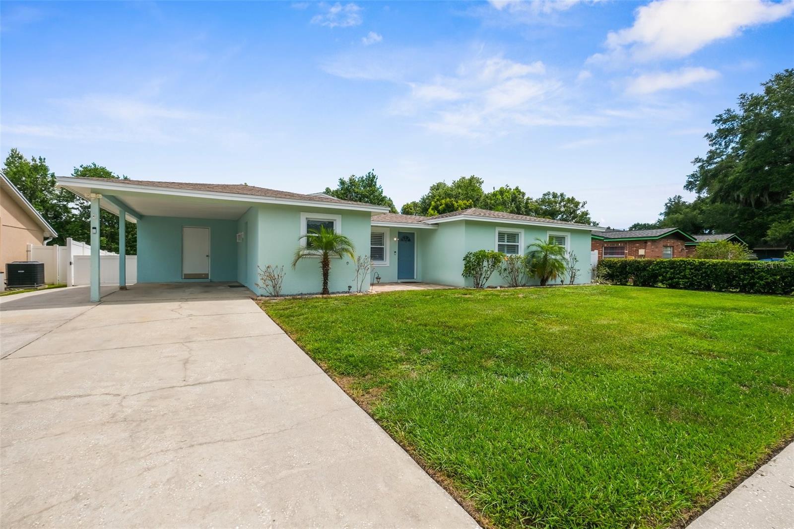 Large driveway with extra parking concrete pad and sidewalk..