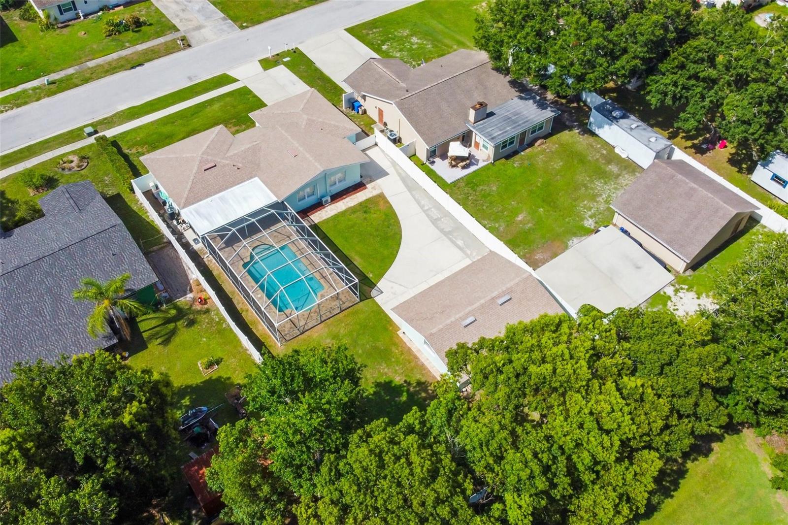 Beautiful view from overhead! See your private pool and detached 3-car garage and workshop in your fenced yard!