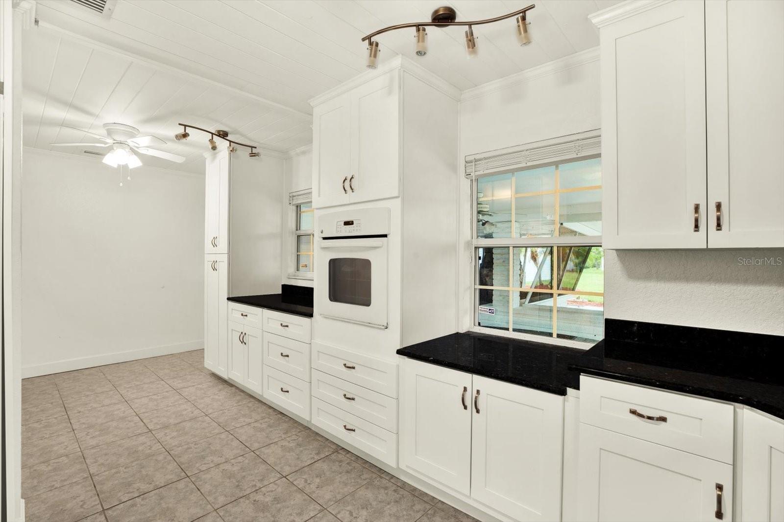 Pass thru window to screened patio for entertaining