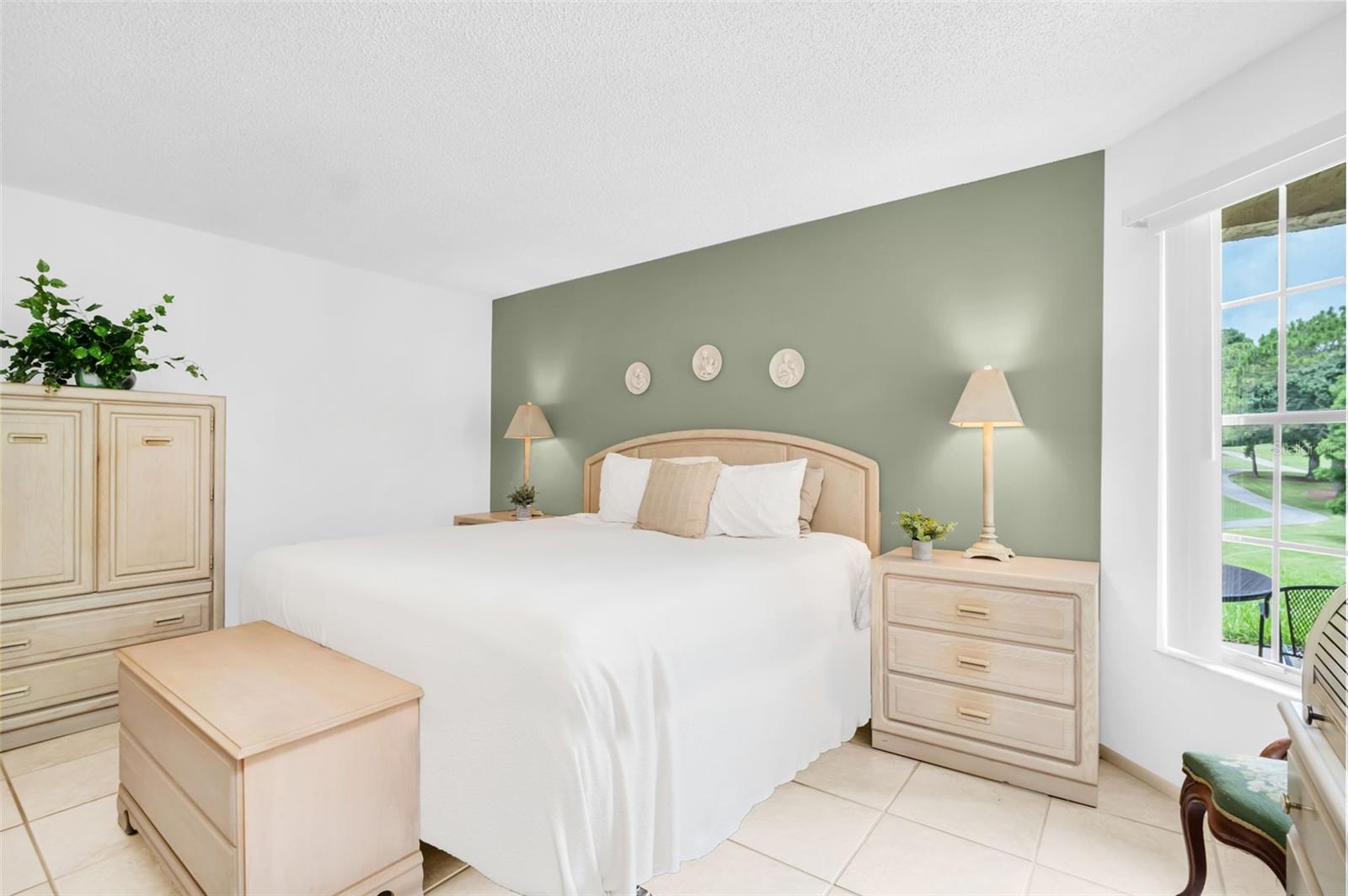 Spacious master retreat privately located at rear of the home with relaxing golf views~