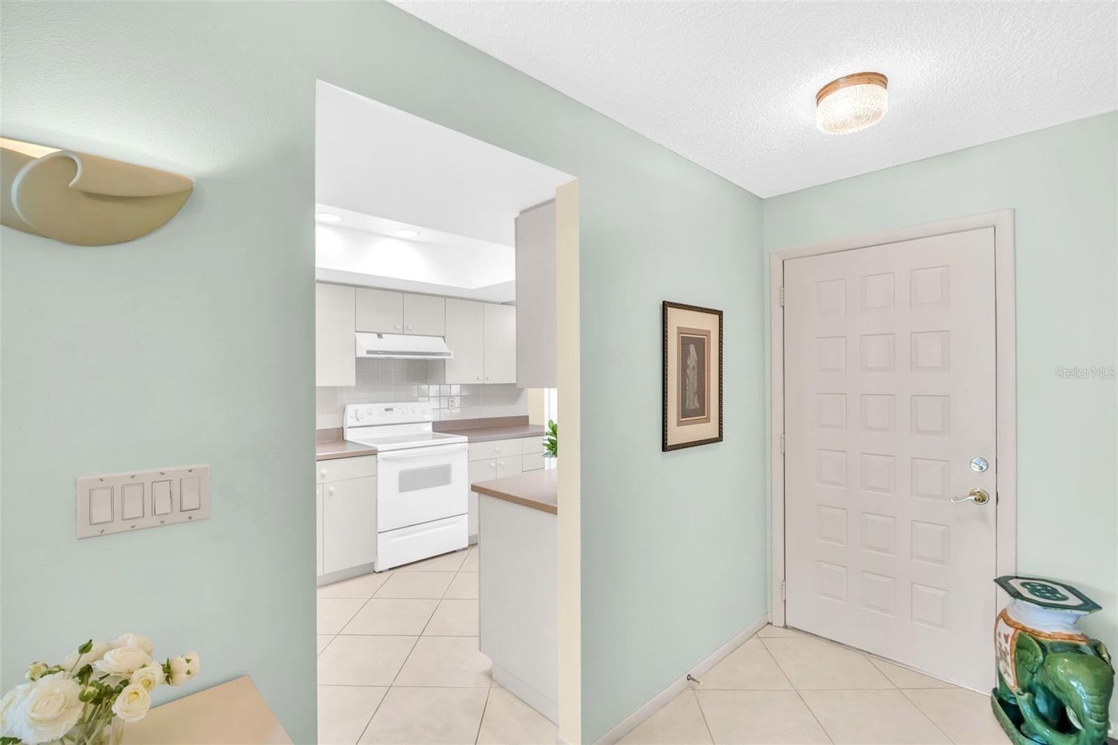 Kitchen perfectly tucked between front entry and main living~