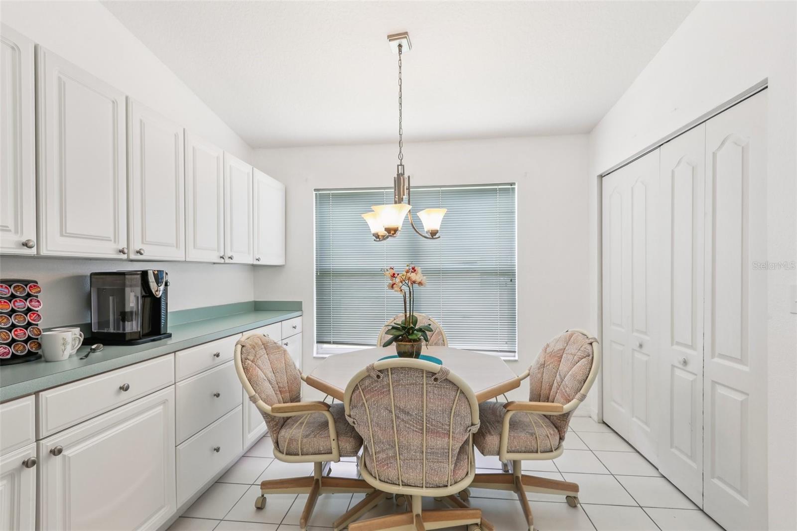 Counters and cabinets extend all the way into breakfast nook. Second pantry and washer/dryer closet to the right.