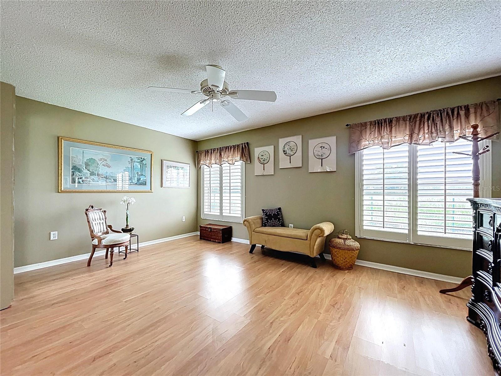 Plantation shutters and vinyl wood flooring