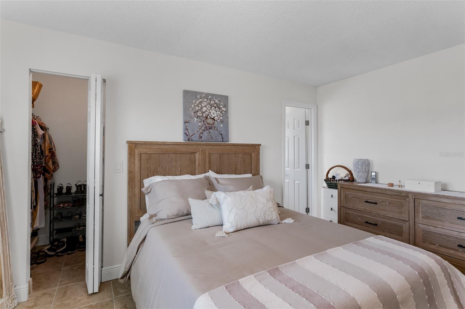Primary bedroom with walk in closet