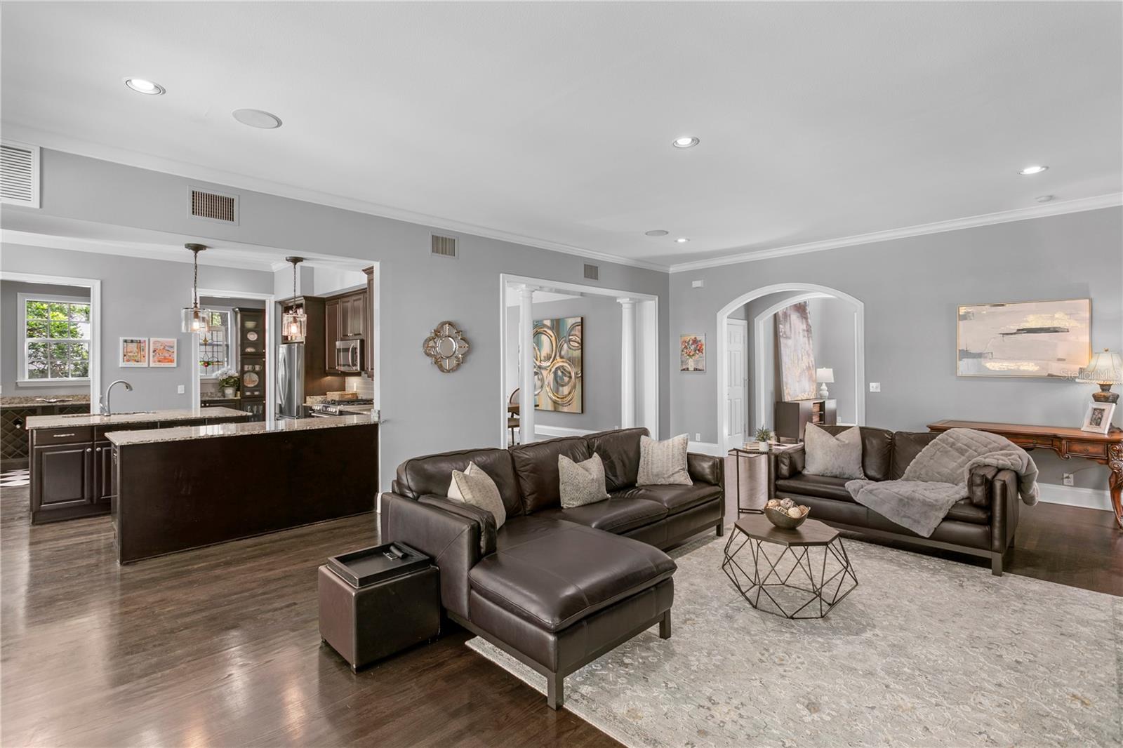 A seamless connection between the family room, open kitchen, and surrounding living spaces creates a natural flow