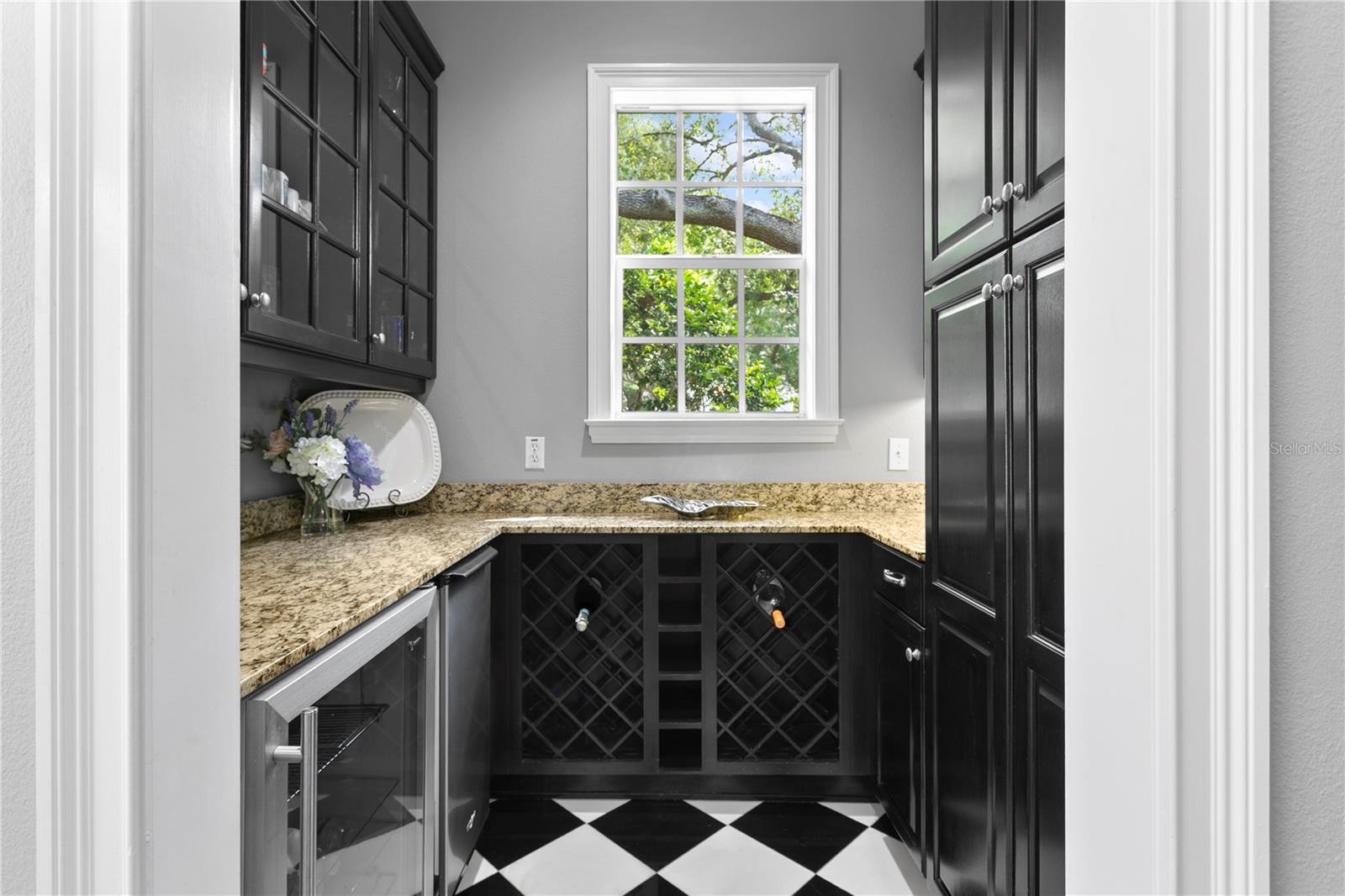A dedicated wine bar area, complete with its own refrigerator, adds a touch of luxury